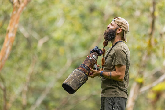 Nature photographer observing with patience