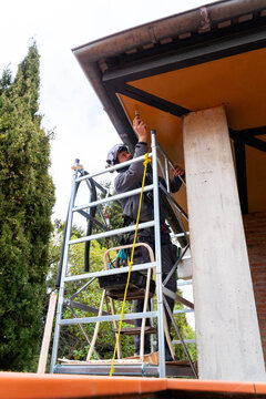 Professional contractor working on height
