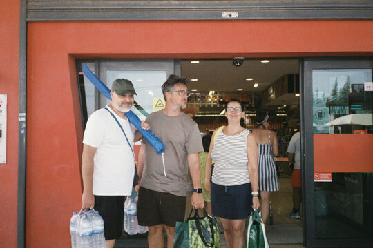 People Leaving Store with Supplies
