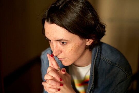Young Woman Deep in Thought During Quiet Evening Reflection