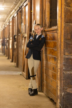 Young Girl portrait in horse barn 