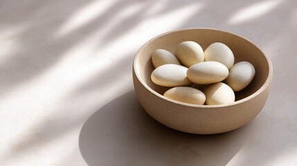 Realistic Clay Bowl Filled with Simple Stone Eggs on a Calm Surface