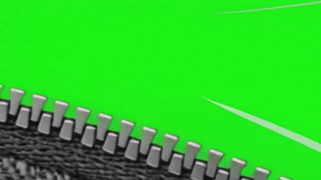 A llic zipper pull slides open on dark fabric revealing a green screen.