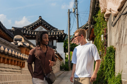 Tourist Having A Conversation In Bukchon Hanok Village, Seoul.