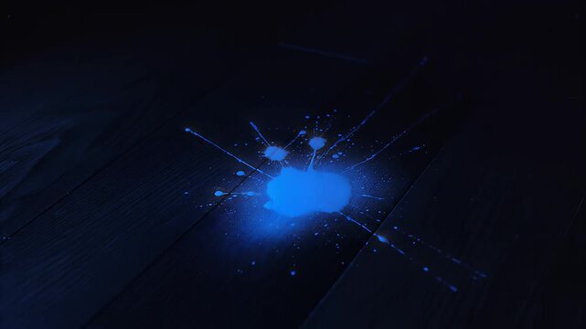 Blue glowing liquid splash on dark wooden floor for forensic or visual background