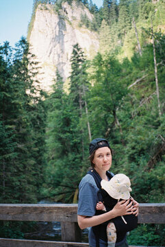 Mother and sleeping in the sling baby