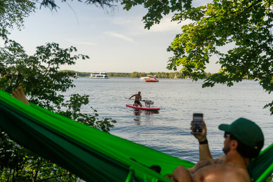 Friends Relaxing In Summer Nature