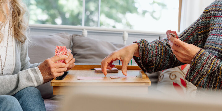 Two individuals enjoying a card game at home