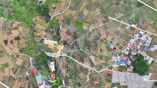 Aerial Panorama of Spring Karst Landscape: Green Hills, Water Fields, and Rural Village, Guangxi