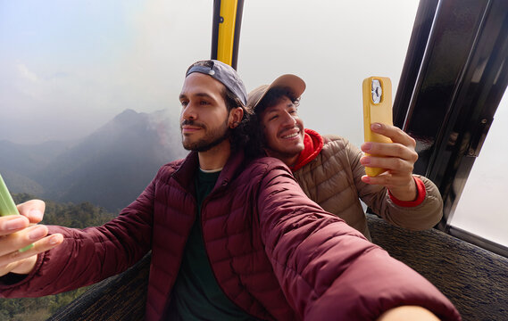 Men taking selfie in cable car Sa Pa Vietnam