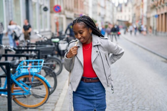 Joyful Stroll Through Lively City Streets With Stylish Flair