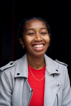 Smiling Woman in a Stylish Jacket Poses for a Portrait