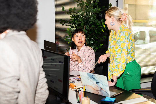 Colleagues engaged in productive conversation 
