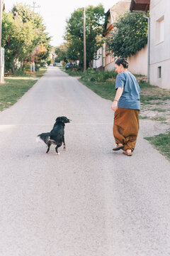A woman with her mixed-breed dog 