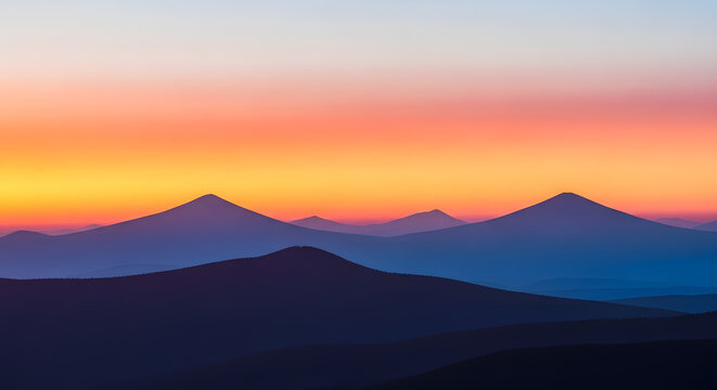 Serene mountain landscape at dusk with vibrant sky.
