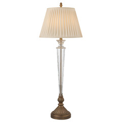 Elegant floor lamp with ornate metal base and cream shade