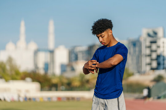 Athlete checking smartwatch during training session