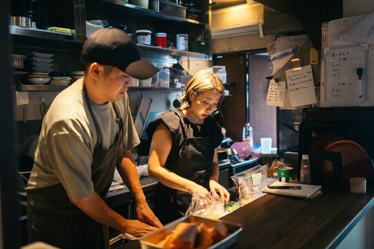 Japanese cooks working on traditional dishes