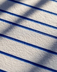 Fototapeta premium Textured paper with blue lines and shadows lined