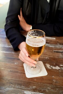 Enjoying a Refreshing Drink at a Cozy Bar in the Evening