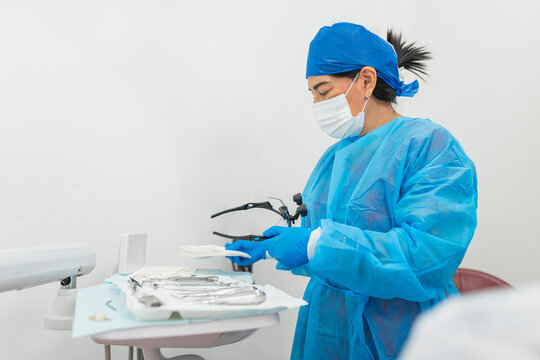 Dentist preparing dental instruments