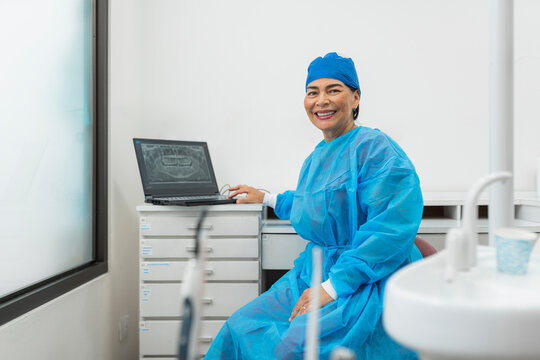 Smiling dentist in dental clinic