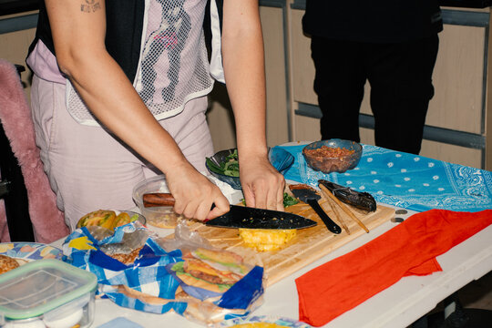 Cooking a meal with fresh ingredients at a vibrant gathering