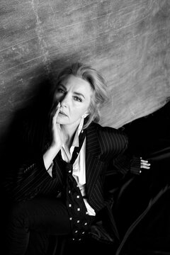 Black and white portrait of woman in oversized suit