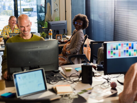People enjoying working at office 