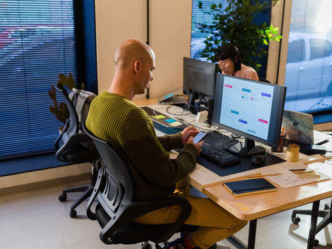 Man using smartphone at work 