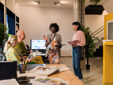 A Diverse Group of Professionals Collaborates in a Contemporary Office