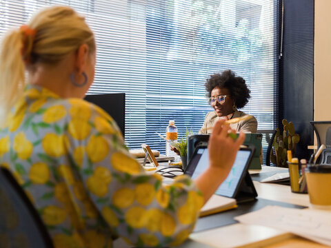 Happy colleagues working at office