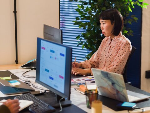 Designer Working at a Modern Office Desk 