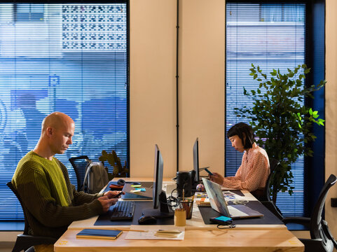 People using smartphones at office