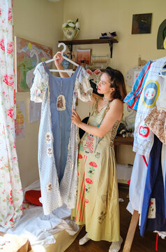 a female designer shows off her clothes