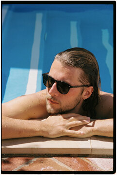 A man relaxing in the pool