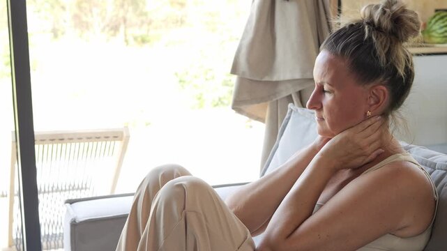 Burnout recovery routine reducing muscle tension through calm indoor relaxation woman practicing stress relief stress management stress recovery supporting balance and healthy lifestyle at home