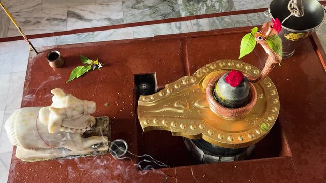 sacred shiva lingam with naga serpent and nandi idol in hindu temple worshiped on shivratri