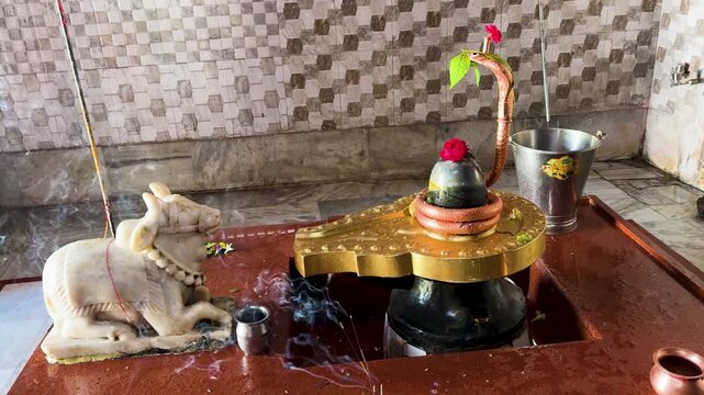 spiritual temple altar with incense smoke and sacred shivling offering on shivratri