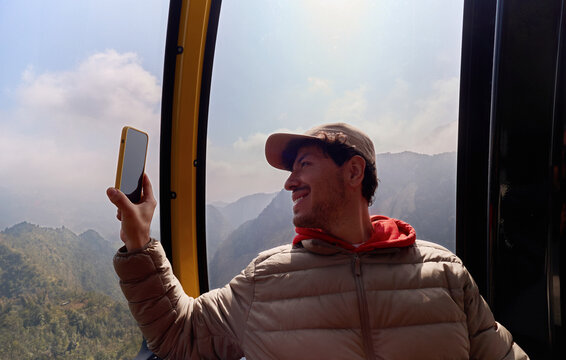 Man using phone on Sapa cable car