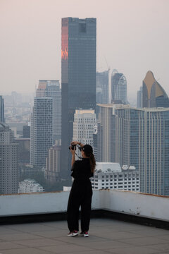 Rooftop Photographer with City Skyline