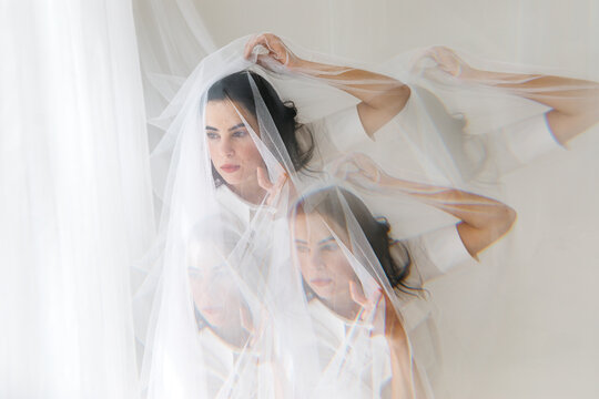 Woman with veil multiple exposure concept