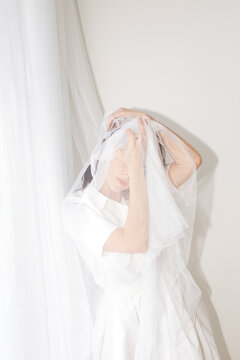 Woman with white tulle veil