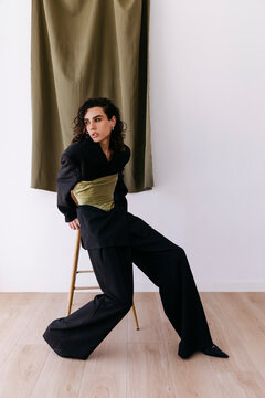Queer man posing in stylish gender fluid fashion