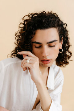 Queer man looking down