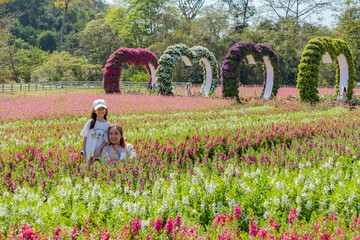 Mother and Daughter in Flower Field