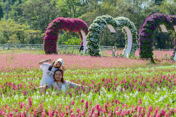 Mother and Daughter in Flower Field