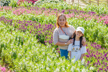 Mother and Daughter in Flower Field