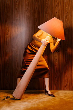 Dramatic Portrait of Person With Large Lamp Shade