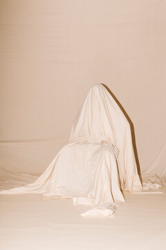 Draped Figure in Beige Fabric Studio